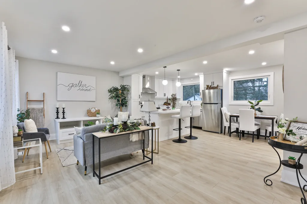 Bright open-concept kitchen and living area in a finished custom home
