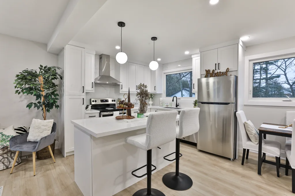 Finished white kitchen and open living space in a high-end GTA home
