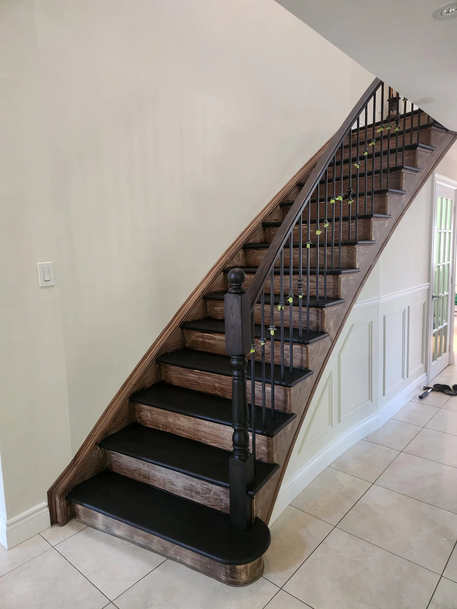 Before — original hardwood staircase before Sigma Painting refinishing