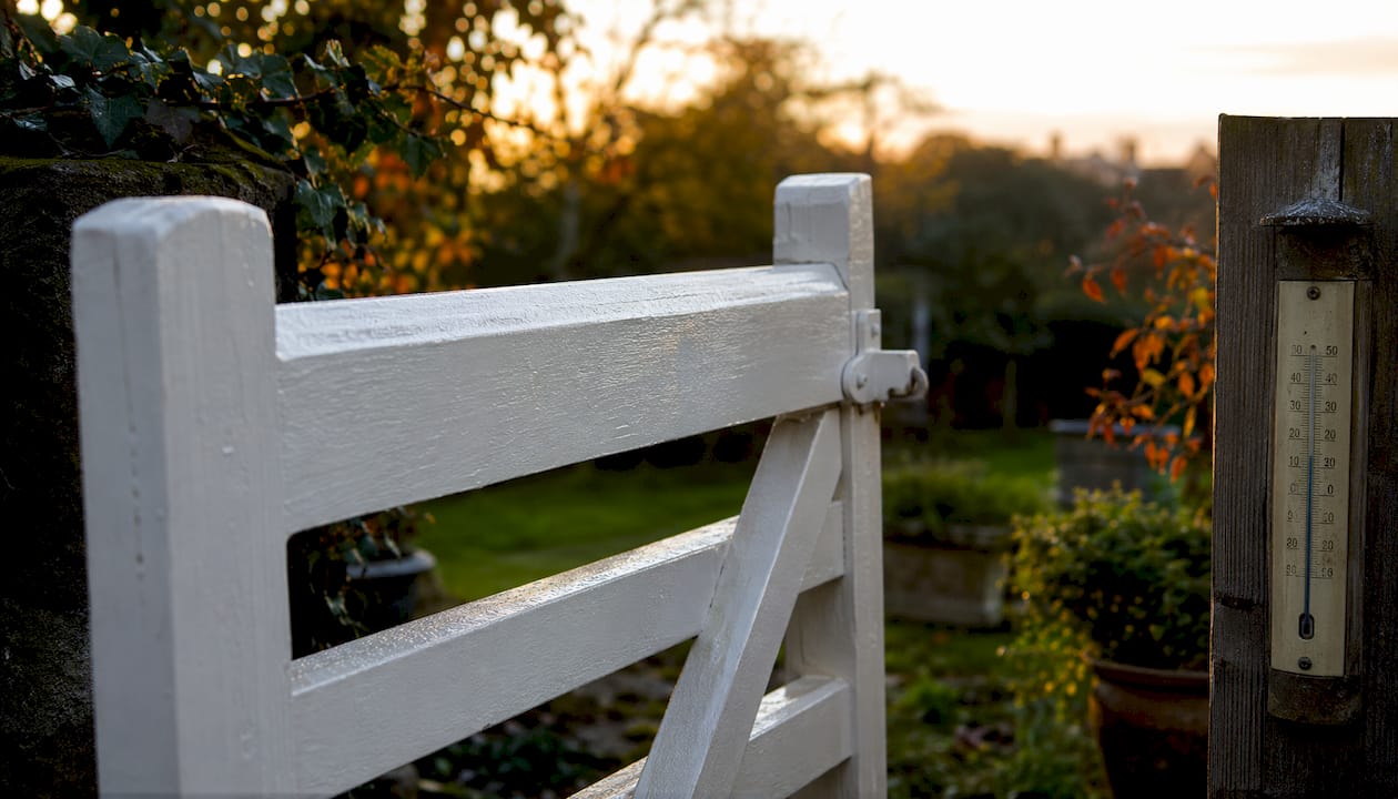 Painted fence with temperature monitoring outdoors